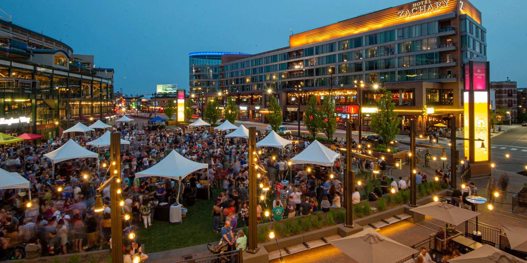 Gallagher Way plaza at Wrigley Field lit up at night